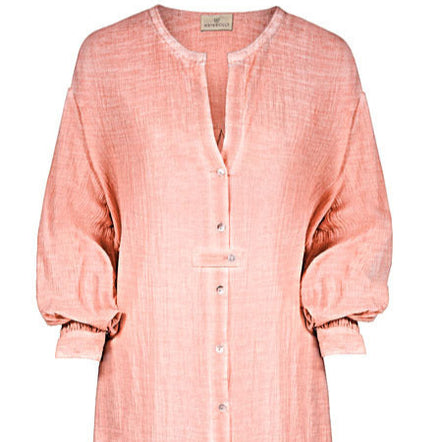 Pink dress with buttons on a white background