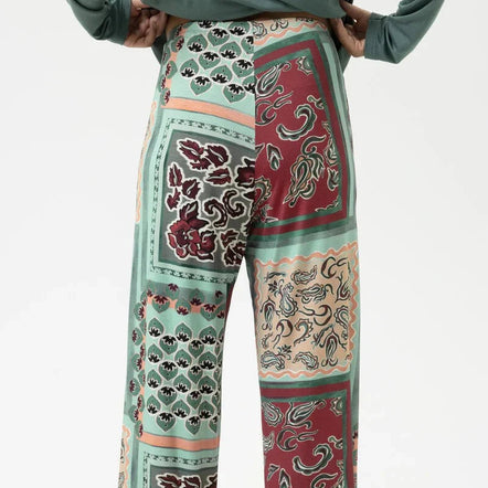 Patterned pants with a mix of colors on a white background