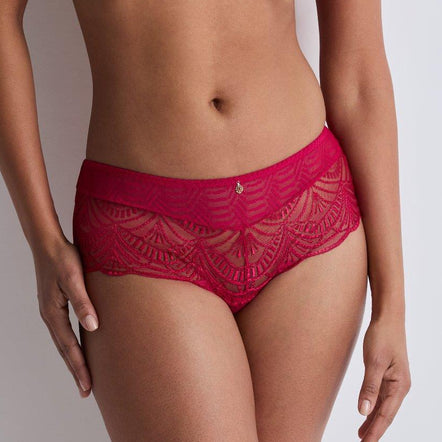 Red lace lingerie set on a plain background