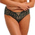 Person wearing a green lace underwear set on a white background
