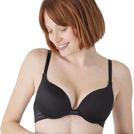 Woman wearing a black bra on a white background