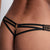 Black strappy thong on a person against a white background
