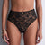 Black lace underwear worn by a model on a neutral background