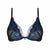 Black lace underwire bra with intricate blue and teal floral embroidery and sheer mesh panels, shown against a plain white background.