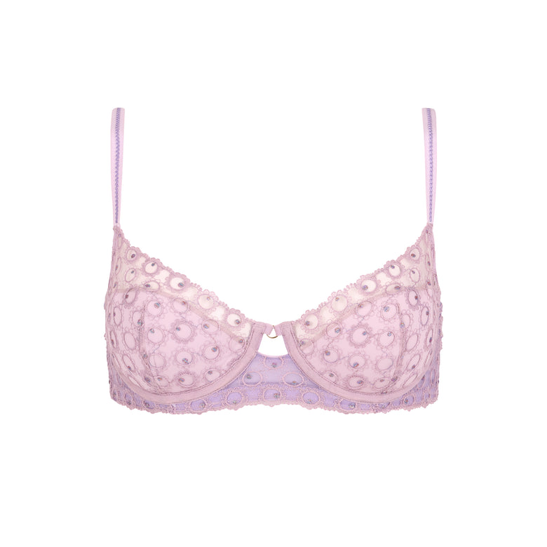 Pink bra with lace details on a white background