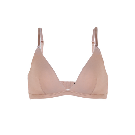 Beige bra and panties set on a white background