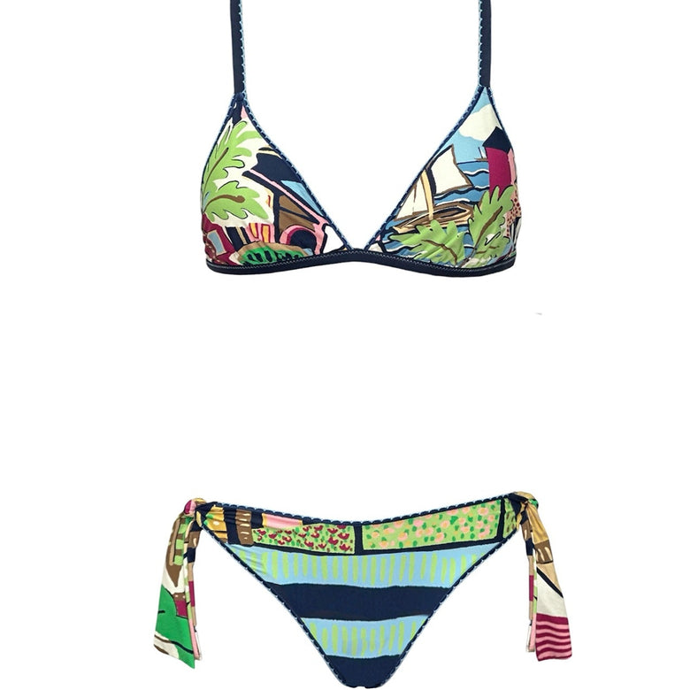 Colorful bikini set with a tropical pattern on a white background