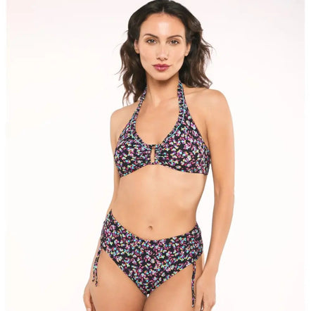 Woman wearing a floral bikini set on a white background