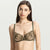 A woman modeling a dark olive green lace lingerie set against a light gray studio background.