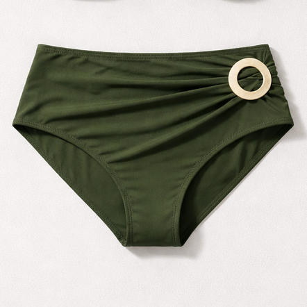 Green underwear with a wooden ring on a white background