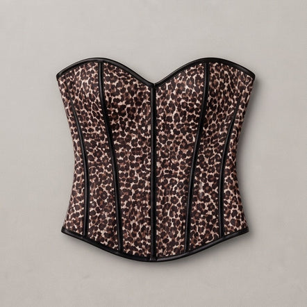 A leopard-print corset with black trim, displayed flat against a neutral light gray background.