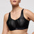 Black sports bra with geometric pattern on a neutral background